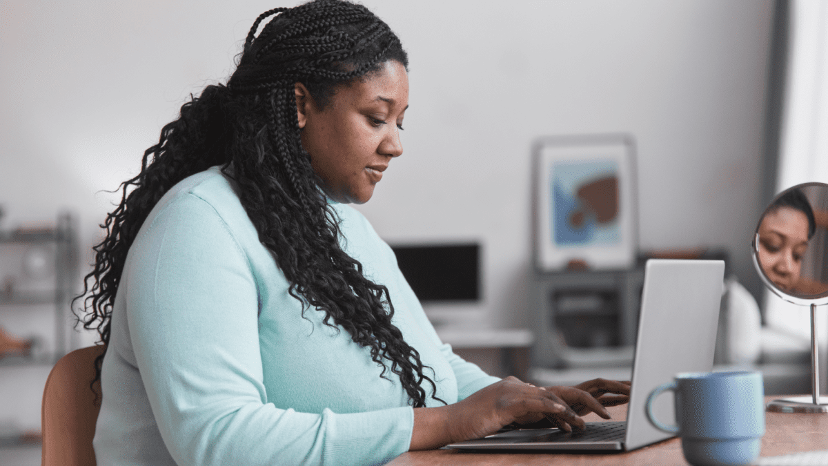 Woman studying weight bias on her computer