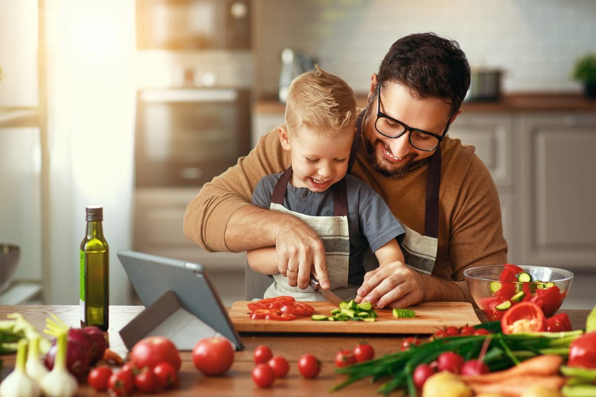 Father and son cooking together